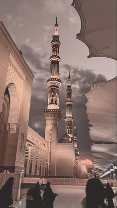 an artistic view of a mosque with people walking around it