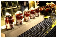 several cans of soda are lined up on a counter