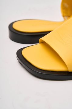 Heel height 0.8in Genuine Leather Lining - Genuine Leather Introducing the Alo Flop Flops, a vibrant and stylish addition to your summer wardrobe, proudly crafted by Fabio Monelli in Turkey using premium, natural leather. These flip-flops combine comfort and fashion effortlessly, making them an essential choice for any casual occasion. Modern Yellow Leather Sandals, Summer Leather Flip Flops With Leather Sole, Leather Sole Flip Flops For Summer, Yellow Summer Slides With Rubber Sole, Yellow Rubber Sole Slides For Summer, Yellow Slides With Rubber Sole For Summer, Summer Leather Mules With Flat Heel, Leather Mules With Textured Footbed For Summer, Leather Mules With Leather Lining For Summer