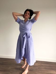 "Handmade 100% loose wrap linen dress with pockets and sleeves. Made with love for You. *100% local medium weight linen *Each item is individually cut and sewn by order *The model is wearing size M/L, dress color - lilac blue *The model height is 172 cm *Note that colors may look different on your display depending on their settings and technical characteristics. Please let us know if you need different measurements or colors. CARE *Machine wash up to 40 / 104F gentle cycle *Iron inside out at m Linen Midi Dress With Tie Waist, Casual Linen V-neck Wrap Dress, Short Sleeve Linen Sundress, Linen V-neck Wrap Dress For Daywear, Casual Linen Wrap Dress For Beach, Summer Wrap Linen Maxi Dress, Summer Linen Wrap Maxi Dress, Beach Linen Wrap Dress, Linen Short Sleeve Maxi Sundress