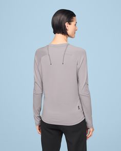 Where style meets sweat-wicking. This long-sleeve tee is quick-drying and made to lock-in warmth Moisture-wicking - A distraction-free, ergonomic design that feels soft and luxurious on your skin. With moisture-wicking breathable fabric for total freedom, however you move. All-day wear - Sleek. Comfortable. Designed for high performance all day long, taking you from yoga class to your 10K run and beyond. Streamlined construction - Contoured to fit your body with strategically-placed darts follow Technical Long Sleeve Tops For Fall, Gray Technical Long Sleeve Activewear, Technical Gray Long Sleeve Activewear, Technical Midweight Long Sleeve Activewear, Running Tops With Thumbholes And Long Sleeves, Running Long Sleeve Top With Thumbholes, Long Sleeve Running Tops For Fall, Versatile Long Sleeve Running Tops, Long Sleeve Tops For Running In Fall