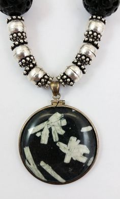 "The round, Sterling Silver wrapped Pendant in this necklace is made of Chinese Writing Stone. The carved round black beads in this necklace are an unknown material, possibly Onyx but maybe just glass or another black stone. The silver beads and clasp are Sterling Silver. Approximate Length (clasped): 11-1/2\" - (end to end): 25\" Black Bead Diameter: 18mm Silver Bead Diameter: 9mm Pendant Size: 40mm Diameter x 6mm Thick Approximate Total Weight: 5.2 Oz Rabbask Designs is a small business locate Spiritual Black Beads Round Jewelry, Spiritual Black Beads Jewelry, Black Bohemian Medallion Jewelry, Handmade Black Medallion Necklace, Traditional Black Jewelry With Round Pendant, Traditional Black Round Pendant Jewelry, Handmade Circular Black Necklaces, Handmade Black Circle Necklace, Handmade Circular Black Necklace