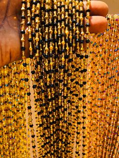 "❀ This Crystal listing is from 20 to 100 strands of waistbeads ❀ Beads Ship directly from Ghana ❀ Bead length is 47\"Note. Bead length cannot be made longer than 47inches. ❀ Regular Beads sizes vary from size 6/0 to 8/0, 11/0 to 8/0 ❀ DHL requires customer's phone number during shipment, please provide one ❀You will receive quality & gorgeous waistbeads not limited to the ones in the display pictures ❀ Beads are made with Cotton Strands to prevent any allergic reactions ❀ Shipping takes 3-5 Business days after processing(3-4 business days) ❀ Email me with any questions. I am usually quick at responding" Traditional Party Waist Beads, Oval Beads Beaded Necklaces For Party, Traditional Beaded Chain Beads For Party, Gold Beaded Necklaces For Festivals, Traditional Waist Beads With Beaded Chain, Traditional Gold Waist Beads With Faceted Beads, Oval Beaded Chain For Party, Festive Gold Beaded Necklaces With Black Beads, Gold Beads With Beaded Chain For Festivals