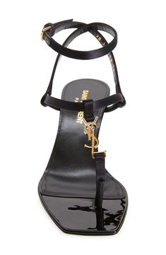 Interlocking YSL hardware brings a golden touch to a silk-kissed-satin square-toe sandal with a strappy profile and demure kitten heel. 2 1/4" (60mm) heel Adjustable strap with buckle closure Textile upper/leather lining and sole Made in Italy Designer Shoes Evening Sandals With Ankle Strap And Gold-tone Hardware, Luxury T-strap Sandals For Evening, Elegant Ankle Strap Sandals With Gold-tone Hardware, Designer T-strap Heels For Evening, Designer Evening Heels With Gold-tone Hardware, Kitten Heel Shoes, Square Toe Sandals, Kitten Heel Sandals, Strap Sandals Women