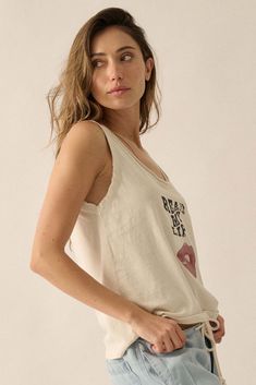 Mineral washed graphic tank top. Vintage-style "Read My Lips" text print with lips graphic. Scoop neckline with raw edge. Sleeveless with raw-edge arm holes. Scoop back. Relaxed fit. 100% Cotton. Imported top designed and printed in LA. Model wears size S. Summer Scoop Neck Top With Graphic Print, Summer Muscle Tee With Scoop Neck And Relaxed Fit, Summer Relaxed Fit Muscle Tee With Scoop Neck, Soft-washed Relaxed Fit Muscle Tee For Summer, Summer Soft-washed Relaxed Fit Muscle Tee, Summer Soft-washed Relaxed Muscle Tee, Sleeveless Graphic Print Tops For Everyday, Everyday Graphic Print Tank Top, Sleeveless Graphic Print Tops For Loungewear