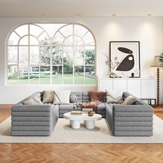 a modern living room with large windows and wooden flooring is pictured in this image