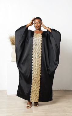 Mums are the best, lets celebrate us with our new collection of luxury Mikado Kaftan Boubou. One size fits all featuring detail gold applique running from neckline to hem, they are comfortable, soft on the skin and perfect for this special celebration. Handmade with Mikado and designed to make you feel trendy and fashionable giving rich African aunty vibes Product Details Style: Boubou Bubu Kaftan Fit: Loose Round neck Length 58" Material: Mikado Colour: Black Care Instructions: Hand wash cold. Mikado Kaftan, African Print Blouse, Dresses African Print, Black Friday Promo, Couples Outfits