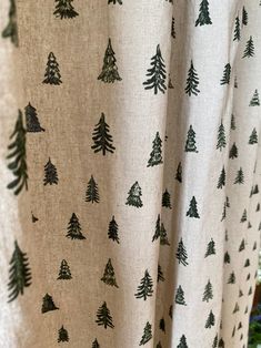 a curtain with trees printed on it