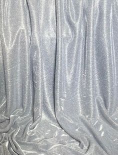 silver fabric with very thin lines on the bottom and sides, as if it were shiny or metallic