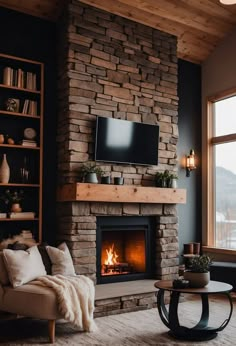 a living room filled with furniture and a flat screen tv on top of a fireplace