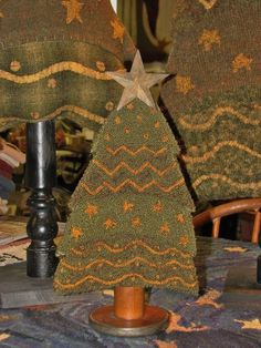 a small christmas tree sitting on top of a table