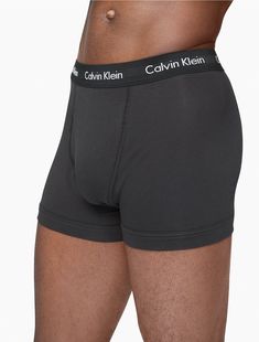 A Calvin Klein icon. The essential designer trunk reinvented in extra-soft cotton stretch. Made with wicking to keep you cool and dry. Designed with the original Calvin Klein logo waistband, this is a sporty look that feels sexy everyday. With a functional fly, supportive pouch and more coverage than our hip brief, this style is easy under anything.  Material: 95% Cotton, 5% Elastane. Calvin Klein Cotton Boxer Briefs With Logo Waistband, Calvin Klein Stretch Boxer Briefs With Logo Waistband, Casual Fitted Boxer Briefs With Logo Waistband, Fitted Boxer Briefs With Logo Waistband, Fitted Boxer Briefs With Ribbed Waistband, Classic Cotton Boxer Briefs With Logo Waistband, Fitted Calvin Klein Boxer Briefs, Sporty Fitted Calvin Klein Boxer Briefs, Calvin Klein Fitted Boxer Briefs For Sports