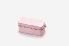 a pink case sitting on top of a white surface