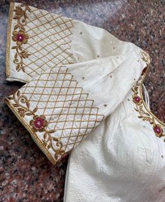 Hand embroidered ready made saree blouse / crop top/stitched saree blouse usa / white saree blouse/modern blouse/zardosi blouse/cream saree blouse/ pure silk blouse/ maggam work blouse        It is very true that a perfect blouse is the one which makes your saree look stand out !! If you find one of such a style that you have been wanting to have then dont let it go !! we carry such unique trending blouses that instantly add a stylish look to any saree !!      Here is a beautiful Hand embroidered zardosi work saree blouse in cream color that has U neck design front and back  emblished with gold and antique hand embroidered on neck sleeves  front and back as shown!! Runs with any self or contrast color saree ! Please message us for any color / size customization !!  Fabric : pure raw silk White Semi-stitched Blouse With Resham Embroidery, Semi-stitched Dola Silk Blouse Piece With Handwork, Semi-stitched Raw Silk Blouse Piece With Resham Embroidery, Semi-stitched Raw Silk Blouse Piece With Handwork, Saree Blouse Modern, Semi-stitched Dola Silk Blouse With Intricate Embroidery, White Saree Blouse, Zardosi Blouse, Cream Saree