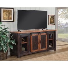 Bring a touch of cottage farmhouse charm to your living room with this rustic TV Stand. Made of solid pine wood and veneers, the TV console features a distressed pine finish that adds character and style to any family room décor. Wood And Metal Tv Stand, Tv Stand Antique, 65 Inch Tv Stand, Tv Stand Plans, Metal Tv Stand, Rustic Tv Stand, Diy Tv Stand, Farmhouse Tv Stand, Barn Style Doors