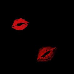 two red lips are shown in the dark