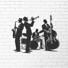 the silhouettes of musicians are shown against a brick wall