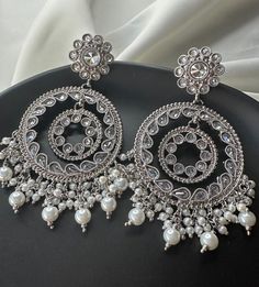 - Polki Stone Earring - Silver Earring - Pearl Earring - White and Silver Pearls - Indian Earrings - Bollywood Earrings - Wedding Earrings - Antique Silver - Perfect for Weddings, Brides, Casual Events, Diwali, Eid  - 100% Satisfaction Guarantee: Long Lasting Plating, High-Quality Stones.  - Medium to large size - Wearable with any outfit - Perfect for any occasion- Western, Indian and Casual - Easy to wear and remove - Premium Quality and High craftsmanship Care Tips - Keep away from water, per Jewelry Accessories Indian, Silver Indian Earrings, Silver Kundan Earrings, White Earrings Indian, Long Earrings Indian, Silver Earrings Indian, Silver Jhumka Earrings, Bollywood Earrings, Silver Jhumkas