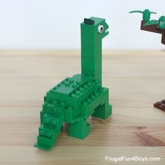 two lego animals made to look like they are standing next to each other on a table