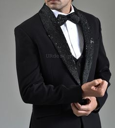 Designer Black Tuxedo Suit With Sequins and Pearl Handwork on Satin Lapel & Trouser for Prom, Wedding, Party, Reception, Groom, Gifts, Dance Material: Suiting, Satin Lining Style : Slim Fit Italian Cut  Slit Details : Double Slit Color : Black Button Types : - Fancy Button, with Pocket Square Wash Type : Dry Clean Only Bottom Type : Trouser Bottom Fabric : Suiting Bottom Color : Same Color ◾ The Outfit is Fully Stitched and Packaged With Our Branded Suit Cover to Ensure Minimal Wrinkles. ◾ Custo Wedding Suits Men Black Tuxedos Groom Attire Groomsmen, Coat Embroidery Design, Black Tuxedo For Men Wedding Groom Style, Reception Suit For Groom, Black Designer Tuxedo, Pant Design For Men, Black Tuxedo For Men, Wedding Tuxedo For Groom, Tuxedo For Men Wedding