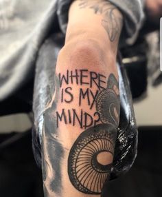 someone with a tattoo on their arm that says where is my mind?