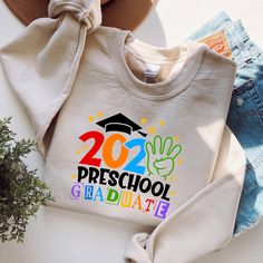 a white sweatshirt with the words, 2020 preschool graduate on it