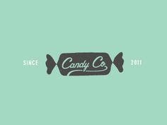 the candy company logo is shown in black and white on a mint green wallpaper