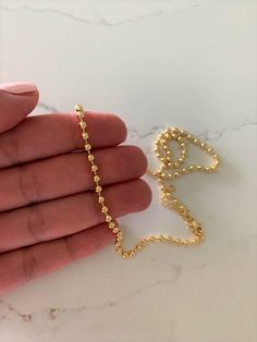 3MM Beaded Gold Filled Chain Necklace | Gold Filled | Layering Ball Gold Chain | Satellite Ball Chain| Beaded Necklace Choker | Beaded ChainHANDMADE-3MM BEADED CHAIN NECKLACE ⁙ Materials: 18K Gold filled⁙ Available Colors: Gold⁙ Measurements: 15.75"+ 2" extender or 20.25"+2" extender, 3MM BeadsHOW TO FIND YOUR PERFECT FITYour neck size is the most important measurement for determining which length will work best for you. To measure, wrap a soft tape measure around your neck, keeping the tape mea Beaded Chain Necklace, Chain Necklace Gold, Zipped Bag, Necklace Choker, Gold Filled Jewelry, Tape Measure, Gold Filled Chain, Ball Chain, Beaded Chain