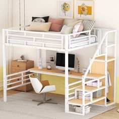 a white loft bed sitting above a desk with a computer on it's side