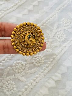 The stunning statement piece will be talk of any party or gathering. Get ready to collect lots of compliments with these gold plated adjusted rings.   Three patterns available, Teardrop, Peacock  and Circle. Price is per piece. 25c coin in the pic is for size reference. Please reach out to us via Etsy messages if any questions, thanks. Namaste 🙏  Length of rings: Teardrop and Circle- 1.5inches Peacock1: 2inches (Big statement ring) Peacock2: 2inches (Big statement ring with green stone) Laxmiji - newly added design in high gold plating and Ruby n green stones .  We have a lot of options available in rings, please visit the "rings and ring bracelets " section under our shop category dropdown. Thanks. Jewelry care: Avoid Contact With Perfumes, Sprays, Chemicals and Water. Keep your Jewelry Big Gold Rings For Women Indian, Vintage Gold Metal Rings, Ceremonial Ring With Antique Finish, Ceremonial Antique Finish Jewelry Ring, Adjustable Antique Finish Wedding Jewelry, Ceremonial Antique Finish Ring, Antique Finish Adjustable Wedding Jewelry, Elegant Brass Rings For Wedding, Antique Gold Engraved Ring For Marriage