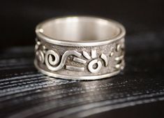 This is a wide chunky silver ring in a single copy. The image is abstract and inspired, without being tied to a specific style, here you can find something from Indians and Scythians at the same time, something from my head, an abstraction. the ring is suitable for both men and women, as well as many works from our collection. The width of the ring is 0.39 inches. Why should you buy a jewelry in my shop? -free woldwide shipping -high-quality - unique author's design -the uniqueness and individuality that you will feel wearing our jewelry -love in every product Order procrssing usually takes 1-3 business How to order: 1.select jewelry. 2. click ADD TO CART. For multiple items go back to the listing and repeat the steps. If you have a problem with your order, please contact us before leaving Unique Hand Forged Engraved Promise Ring, Artisan Sterling Silver Wide Band Ring, Artisan Hand Cast Silver Rings, Hand Cast Wide Band Silver Sterling Ring, Hand Forged Sterling Silver Modernist Rings, Hand Cast Sterling Silver Wide Band Ring, Hand Cast Silver Ring Jewelry, Hand Forged Wide Band Sterling Silver Ring, Modernist Hand Forged Sterling Silver Rings