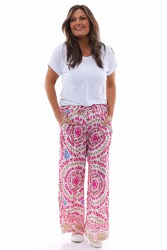 Update your spring wardrobe with our Corzano Tie Dye Palazzo Pants! Made with both comfort and style in mind, these pants are the perfect addition to your wardrobe. The trendy tie dye design adds a fun touch to any outfit. Shop now and elevate your fashion game. - Elasticated waistband with drawstring - Pockets - Bold design Casual Straight Leg Tie Dye Pants, Summer Tie Dye Straight Leg Pants, Pink Ankle-length Wide Leg Pants For Vacation, Spring Pink Wide Leg Pants With Loose Fit, Pink Wide-leg Pants For Vacation, Spring Pink Loose Fit Wide Leg Pants, Straight Leg Tie Dye Pants For Spring, Tie Dye Wide-leg Pants, Pink Ankle-length Harem Pants With Relaxed Fit