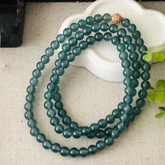 6.8mm High Icy Blue Green Guatemalan Jade Bead Bracelet Necklace Item no. JAG 1036 Jade Measurement: Approximately 6.8mm per bead Shape and Cut: round bead Color: blue green Type: high icy with glow Comments: All natural texture. Special Price and Special Deal! Item and certificate is ready to be shipped!! Very translucent. Can be used as a bracelet or necklace. DIY into many designs. 100% flawless. so beautiful. photos cannot show the beauty and quality. a collection item. highly recommend.  CERTIFICATION All of our items come with their own certificate guaranteeing Type A Jadeite. The Jade Laboratory is a famous gem lab where gems are evaluated by a professional with a detail report verifying the jade is GRADE A, natural. CUSTOMIZATION N/A SHIPPING POLICY We offer FREE USA SHIPPING for U Polished Beads Bracelet For Meditation, Round Polished Beaded Bracelets For Meditation, Meditation Beaded Bracelets With Polished Beads, Round Beaded Bracelets With 108 Beads For Jewelry Making, Single Strand Beaded Bracelets For Jewelry Making, Green Single Strand Beaded Bracelet With Round Beads, Green Single Strand Round Beaded Bracelets, Spiritual Single Strand Bracelet With Round Beads, Jade Bead Bracelet