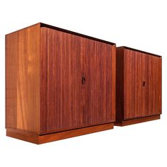 two wooden cupboards sitting next to each other on top of a white background,