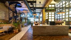 the inside of a restaurant with wooden floors and walls