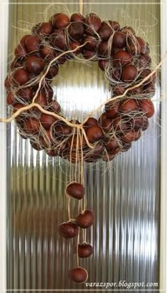 a wreath with nuts hanging from it's side