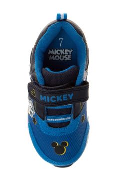 Cute and iconic Mickey Mouse waves upon the side of this vibrant sneaker for your little one to flaunt. Adjustable hook-and-loop closure with elastic laces Synthetic upper and lining/rubber sole Imported Sporty Mickey Mouse Synthetic Sneakers, Disney Mickey Mouse Low-top Sneakers, Sporty Mickey Mouse Sneakers With Round Toe, Disney Character Print Sneakers With Round Toe, Disney Low-top Sneakers With Rubber Sole, Synthetic Sneakers With Character Print And Round Toe, Disney Kids, Elastic Laces, Mickey Minnie