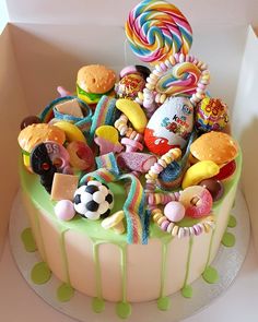 a birthday cake with lots of candies and lollipops