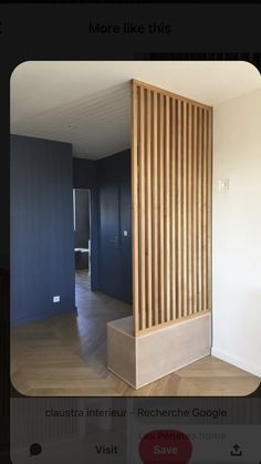 an instagram photo of a room with blue walls and wooden slats on the wall