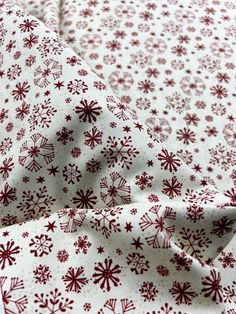 red and white snowflakes printed on fabric