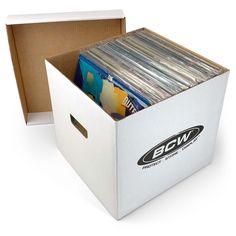 an open box with records inside it on a white background