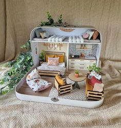 a doll house with furniture and accessories in it