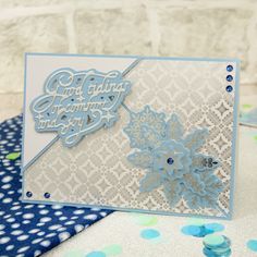 a close up of a greeting card on a table with confetti and polka dots