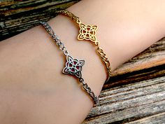 "Add that special touch to your ritual wear with this lovely stainless steel witches knot bracelet. Knot magic is one of the oldest forms of magical practice. Energy is gathered in, a spell cast and bound within the tied knot. It can be left bound or untied at a later time to access that energy. Also known as the \"Magic Knot\", the witch's knot represents protection, manifestation and connection with the divine. This bracelet comes in either silver or gold and is made with an extender to accommodate just about any size. Length (approx): Bracelet: 7 inches long  Extender: 2 inches long Total length with extender: 9 inches This bracelet has a matching necklace which can be found at: https://www.etsy.com/listing/1471283163/witches-knot-necklace-wiccan-jewelry?click_key=2a33dab8e210d456b89a5a Protection Manifestation, Knot Magic, Witch's Knot, Witches Knot, Bracelet Knot, Magic Knot, Tied Knot, Spell Cast, Wiccan Jewelry