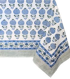 a blue and white table cloth with pineapples on it