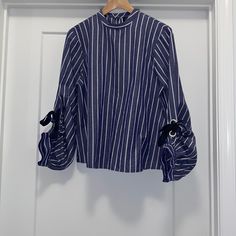 Super Cute Striped Blouse 100% Cotton Bundle And Save! Same Or Next Day Shipping! New To Poshmark? If So, Welcome! Use Code: @Pipermeadow For $10 Off Your First Purchase. Spring, Summer, Date Night, Girls Night Out, Ladies Night Out, Picnic, Concert, Wedding, Work, Preppy, Office, Festival, Trendy, Classy, Business Casual, Contemporary, Guest, Layer, Classic, Business Professional, Fall, Winter, Minimalist, Chic, Dressy, Birthday, Travel, Beach, Dinner, Bachelorette, Vacation, Cruise, Resort, Ca Navy Chic Blouse For Spring, Chic Navy Blouse For Spring, Long Sleeve Blouse With Striped Sleeves For Work, Spring Workwear Blouse With Striped Sleeves, Navy Tops For Spring Workwear, Navy Tops For Office In Spring, Navy Tops For Office Spring Season, Concert Wedding, Beach Dinner