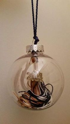 a glass ornament filled with different types of cords