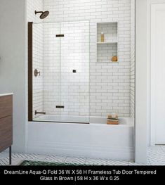 a bathroom with white tile walls and floor, including a bathtub in the center