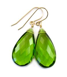 The great fun color of simulated peridot green earrings. Lots of sparkle and the color is richer than the photos. The substantial high quality ear wires are Sterling Silver or 14k Solid Gold or 14k Gold Filled - you choose. The gemstone size is a super large 15x28mm, earrings hang 1.7 inches. The mannequin shows the relative size and how they will hang. Please check out my store for more gemstone earrings, bracelets and necklaces. Remember - Free Shipping! Green Pear-shaped Teardrop Earrings, Green Teardrop Earrings For May Birthstone, Green Teardrop May Birthstone Earrings, Green Faceted Teardrop Earrings, Green Drop Teardrop Earrings For Formal, Green Teardrop Earrings For Formal Occasions, Formal Green Teardrop Drop Earrings, Classic Green Drop Jewelry, Classic Green Pear Shaped Earrings