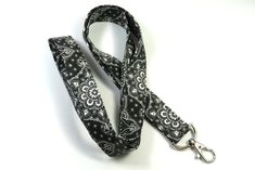 This cute lanyard has beautiful black and gray bandana design. It is perfect for any occasion. You can leave me a convoy if you need a different size. You can have a wardrobe of lanyard to match your outfit. This lanyard is made of soft 100% cotton fabric to give a comfortable feel around your neck. This lanyard is easy to take care. You can spot clean and throw in a washer and hang dry. If you want you can iron and it is ready to use. These lanyards are perfect if you have metal allergy. Each o Black Lanyard With Key Leash As Gift, Adjustable Black Lanyards For Everyday Use, Adjustable Black Badge Holder With Key Leash, Cute Lanyard, Black Bandana, Cute Lanyards, Patriotic Fabric, Fabric Lanyard, Bandana Design